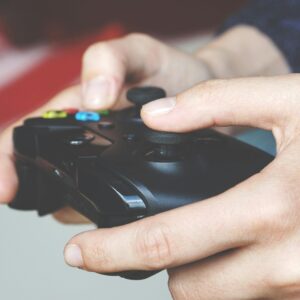 Top 10 Must-Have Mobile Accessories for Students in Pakistan (2026 Guide) | Techium Close-up image of hands gripping an Xbox game controller depicting immersive gaming technology.